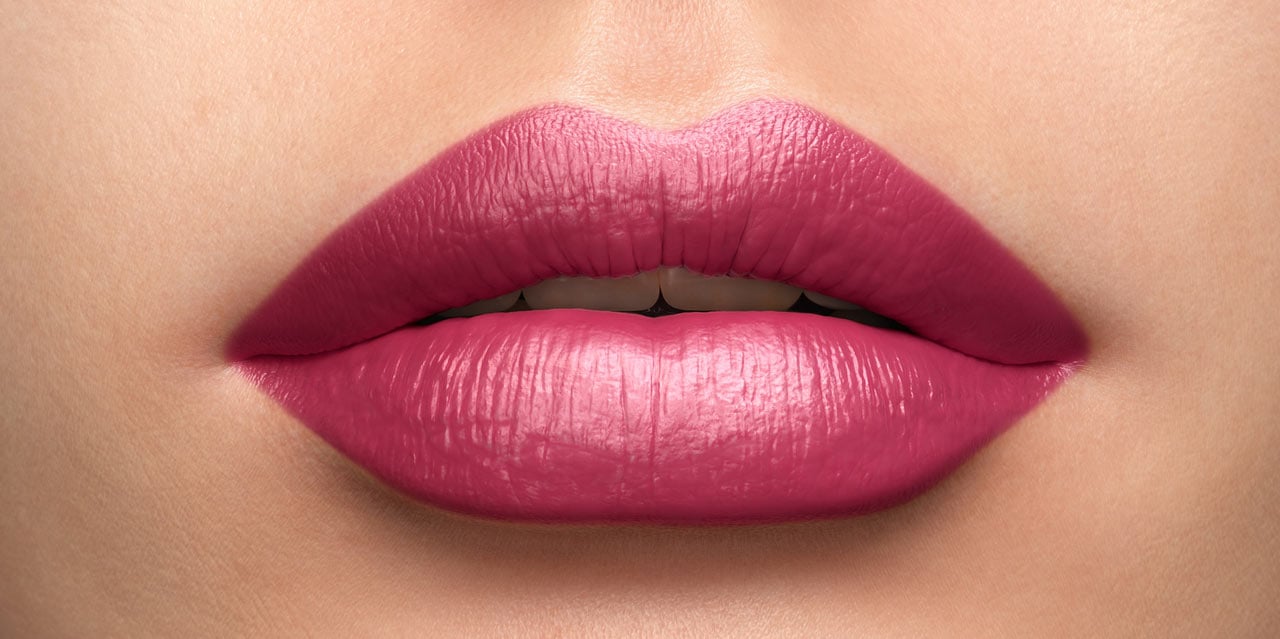 Bright Cool Pink lipstick worn on a light skin tone